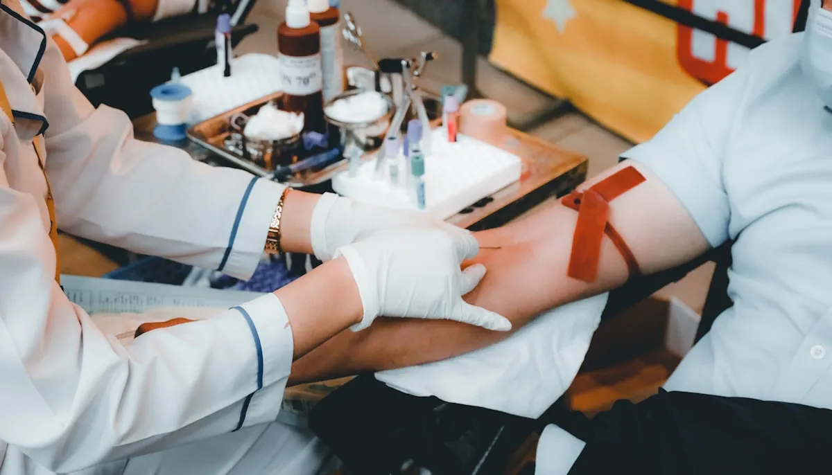 Phlebotomist collecting a blood sample